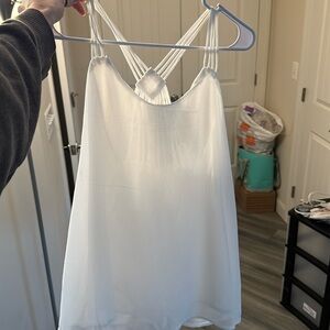 White flowy light tank with multiple straps